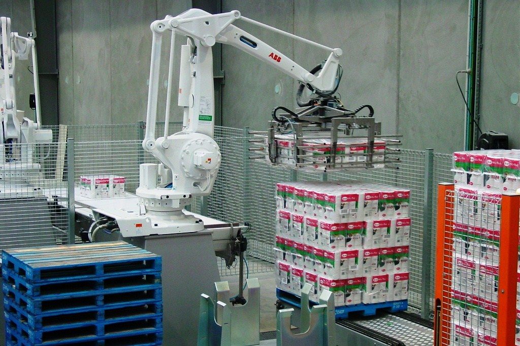 Robotic Case Palletizer stacking pallets efficiently, key to warehouse automation in Australia and New Zealand.