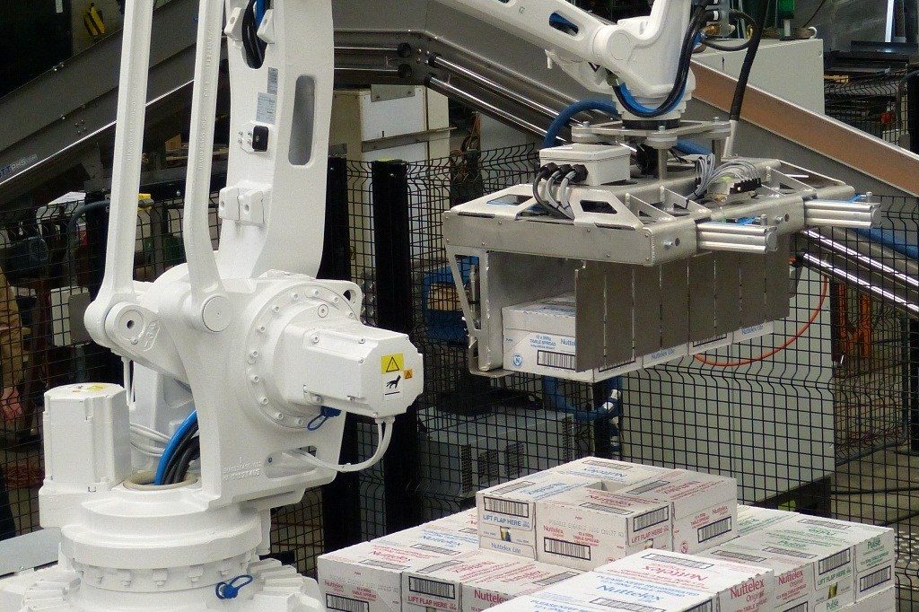 Close-up of PHS Innovate Automatic Case Palletizer robot automating package handling in Australian warehouse.